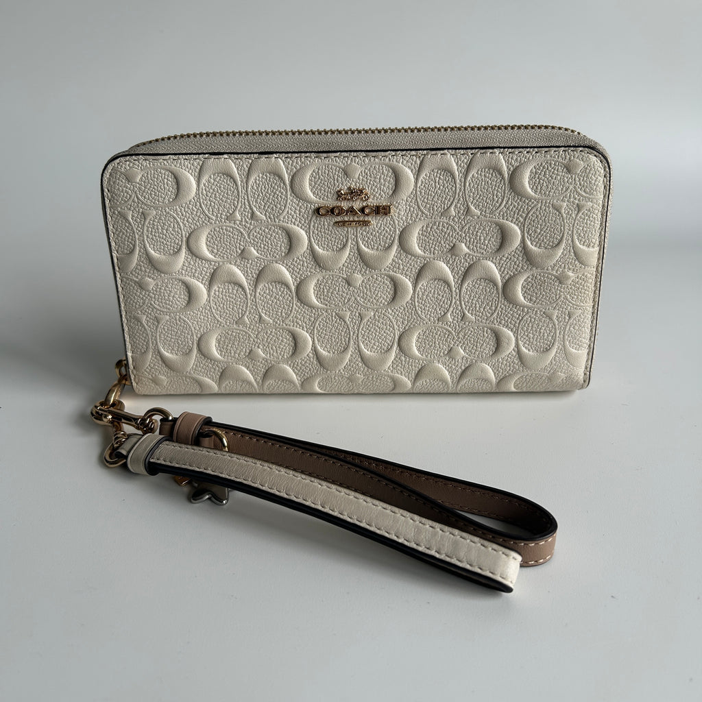 Coach Signature Embossed Chalk White Pebbled Leather Wristlet Excellent