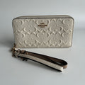Coach Signature Embossed Chalk White Pebbled Leather Wristlet Excellent