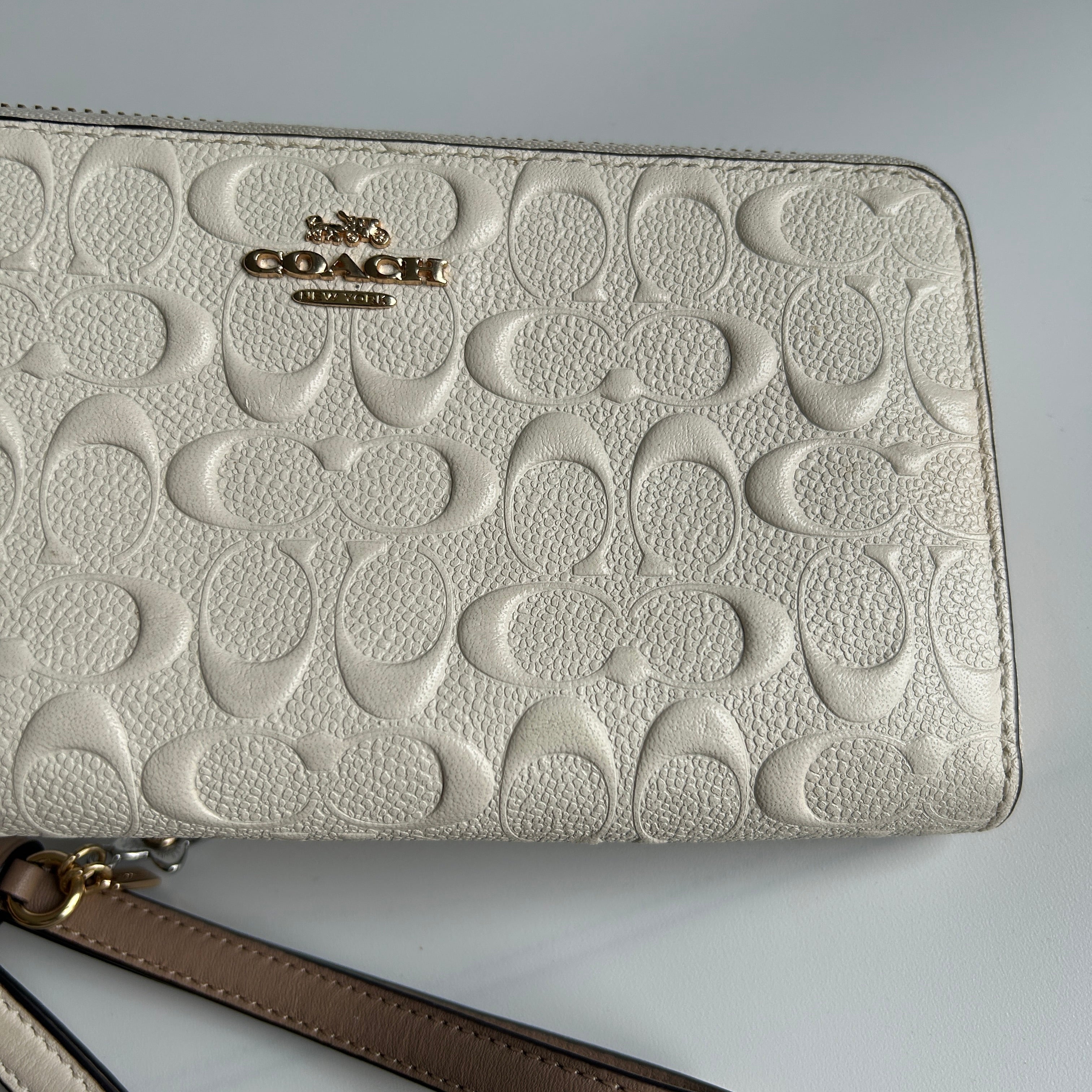 Coach Signature Embossed Chalk White Pebbled Leather Wristlet Excellent